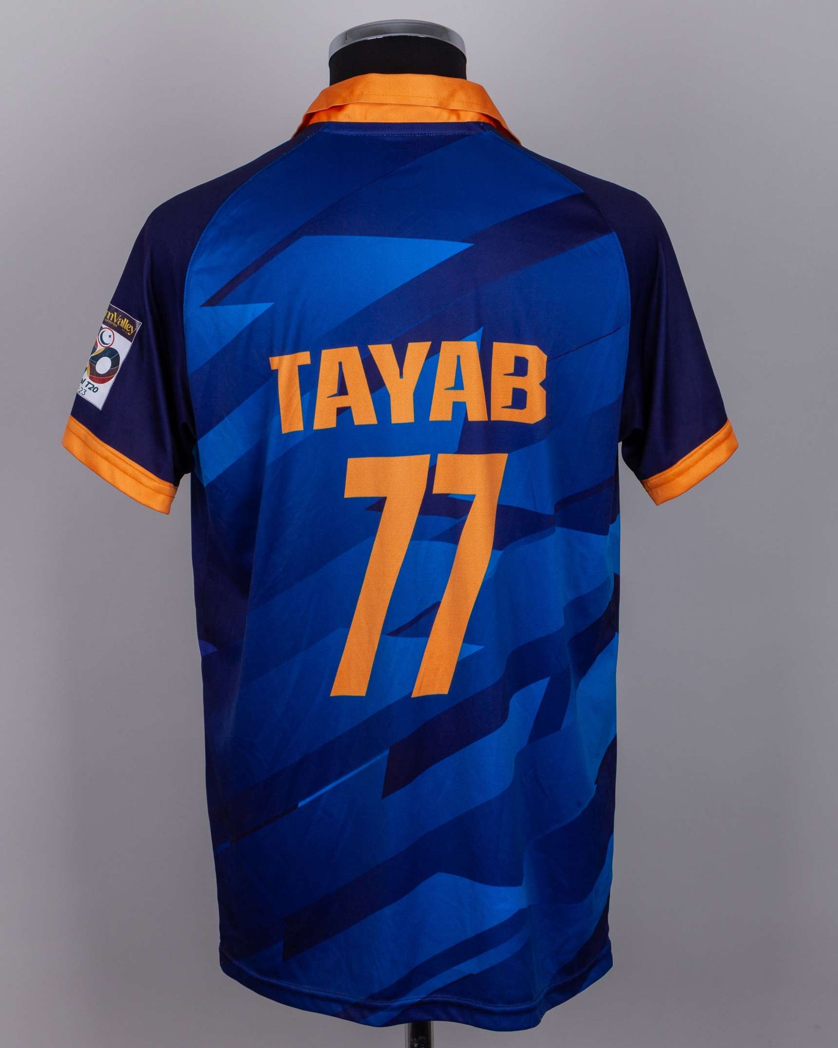 Tayab Tahir a blue and orange No.77 Central Punjab short-sleeved cricket shirt, 2022-23 - Image 2 of 4
