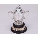 A silver Saxmundham Lawn Tennis Tournament trophy