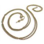 A GUARD CHAIN made in yellow metal the chain has facet cut belcher style links, together with a