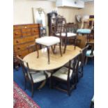 A lot comprising an early 20th century mahogany twin pedestal dining table with one additional leaf,