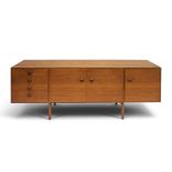 A MID 20TH CENTURY TEAK SIDEBOARD ATTRIBUTED TO IB KOFOD LARSEN FOR G PLAN with pair of central