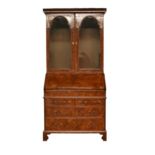 A George II walnut bureau cabinet