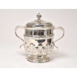 An unmarked silver porringer and cover possibly late 17th century