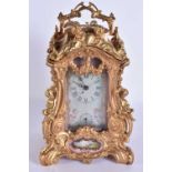 A GILT BRONZE PORCELAIN INSET CARRIAGE CLOCK. 24 cm high.