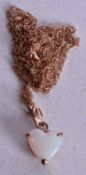 9ct gold heart opal pendant necklace (1.2g). 46 cm long, pendant 1.5 cm x 1 cm.