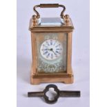 A MINIATURE PORCELAIN CARRIAGE CLOCK. 8 cm high inc handle.