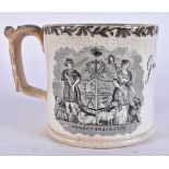 A MID 19TH CENTURY ENGLISH BLACK AND WHITE POTTERY MUG. 15 cm wide.