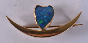 A 9CT GOLD OPAL CRESCENT BROOCH. 3.4 grams. 4.25 cm x 1.5 cm.