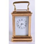A MINIATURE CARRIAGE CLOCK. 9.5 cm high inc handle.