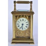 A BRASS CARRIAGE CLOCK. Running. 15 cm high inc handle.