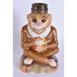 A VERY RARE 19TH CENTURY GERMAN PORCELAIN SEATED MONKEY OIL LAMP BASE. 16 cm high.