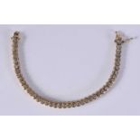 A SILVER GILT TENNIS BRACELET. 16.2 grams. 18 cm long.