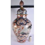 A LARGE 17TH/18TH CENTURY JAPANESE EDO PERIOD IMARI FLOOR VASE AND COVER painted with figures and