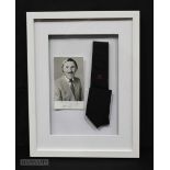 A framed presentation Tie and autographed photograph of the late Bruce Forsyth 42 x 32cm