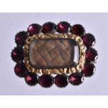 AN ANTIQUE GARNET MOURNING BROOCH. 3 cm x 2.5 cm.