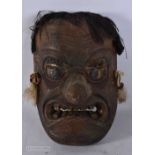 A RARE 18TH/19TH CENTURY JAPANESE EDO PERIOD LACQUERED WOOD TENGU MASK. 24 cm x 14 cm.