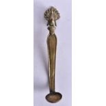 AN ANTIQUE RITUAL SPOON WITH PEACOCK FINIAL. THE SPOON HAS AN OLD REPAIR TO THE BOWL. 23cm long