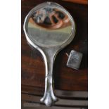 AN ANTIQUE SILVER BACKED MIRROR and a silver vesta case. (2)