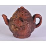A CARVED WOOD TEA POT. 4.7 x 4.7 x 6.9 cm.