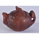 A CARVED WOOD TEA POT. 4.8 x 6.7 x 4.9 cm.