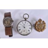 AN ANTIQUE ENGLISH SILVER WRISTWATCH together with a pocket watch and RAF badge. (3)