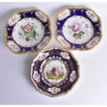 Mid 19th century Coalport plate painted with two figures in a garden, the blue and gilt border