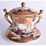 Spode Porcelain gilt headed, handled chocolate cup, cover and stand painted in imari style with