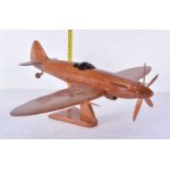 A wooden model of a WW2 Spitfire 17 x 40cm