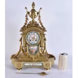 A 19TH CENTURY FRENCH SEVRES PORCELAIN BRONZE MANTEL CLOCK painted with lovers in a landscape. 45 cm