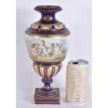 A 19TH CENTURY FRENCH SEVRES PORCELAIN VASE painted with putti within a landscape. 26.5 cm high.
