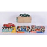 FOUR BOXED VINTAGE SCALEXTRIC MODEL CARS including C3 Javelin, C4 Electra & 2 x Aston Martin C68. (
