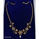 A VICTORIAN 15CT GOLD DIAMOND AND PEARL NECKLACE. 22.1 grams. 40 cm long.