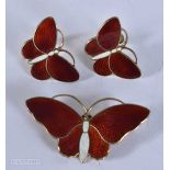 AN ART DECO NORWEGIAN SILVER AND ENAMEL BROOCH with matching earrings. 17 grams. 4.75 cm x 2.5