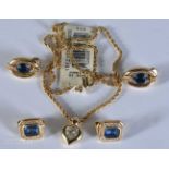 A Boxed Christian Dior Gold Tone Heart Pendant Necklace together with two pairs of Christian