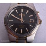 A SEIKO WRIST WATCH. Running. 4 cm wide.