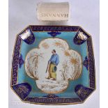 A RARE 18TH CENTURY SEVRES STYLE PORCELAIN DISH with 19th century painted Oriental figure within a