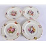 A SET OF FOUR EARLY 19TH CENTURY DERBY PORCELAIN PLATES painted with flowers. 24.5 cm wide.