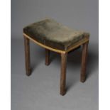 A GEORGE VI OAK CORONATION STOOL BY WARING & GILLOW, 1937, the dished seat in green velvet with gold