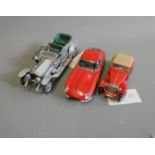 Three unboxed Franklin Mint vintage cars comprising Rolls Royce Silver Ghost, Jaguar E Type and MG