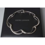 A GEORG JENSEN SILVER INFINITY CHOKER designed by Regitze Overgaard formed of six openwork