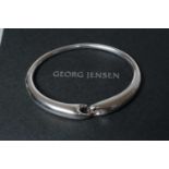 A GEORG JENSEN SILVER REFLECT BANGLE designed by Jacqueline Rabun, stamped 925S, 652, cased and