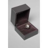 A GEORG JENSEN SILVER SEED AND POD RING collet set with an oval polished moonstone cabochon, stamped