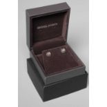 A PAIR OF GEORG JENSEN MOONLIGHT BLOSSOM SILVER EAR STUDS set with cabochon polished moonstones,