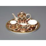 A ROYAL CROWN DERBY MINIATURE SOLITAIRE, 1984, Imari pattern 1128, comprising oval tray, 7 3/4"