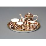 A ROYAL CROWN DERBY MINIATURE SOLITAIRE, 1988, Imari pattern 1128, comprising oval tray, 7 3/4"