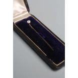 A SOLITAIRE DIAMOND STICK PIN, the old cut stone of approximately 0.25cts, claw set to an unmarked