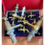 A quantity of brass taps.