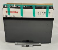 A TOSHIBA 40 INCH LED BACK LIGHT TV MODEL 40L3863DB AND STAND - SOLD AS SEEN.