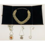 A PERSIAN STYLE WHITE METAL OPEN WORK CHOKER NECKLACE,