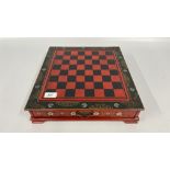AN ORIENTAL DESIGN BLACK AND RED LACQUERED CHESS SET.